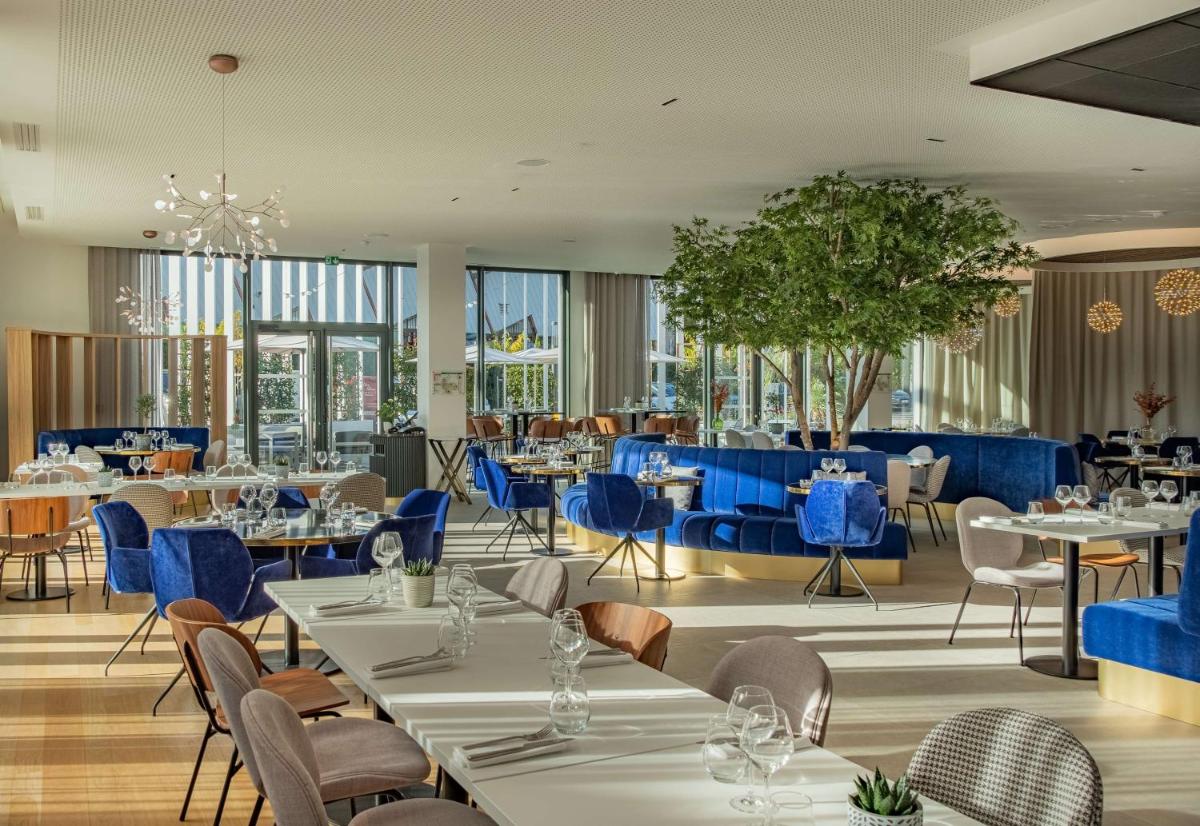 Restaurant ou autre lieu de restauration dans l'établissement GOLDEN TULIP LYON OUEST TECHLID Hotel & Spa