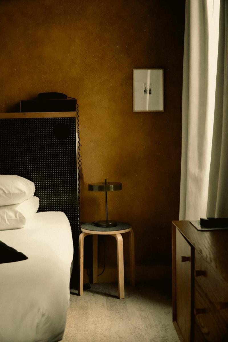 Un ou plusieurs lits dans un hébergement de l'établissement Hôtel La Nouvelle République & Hammam