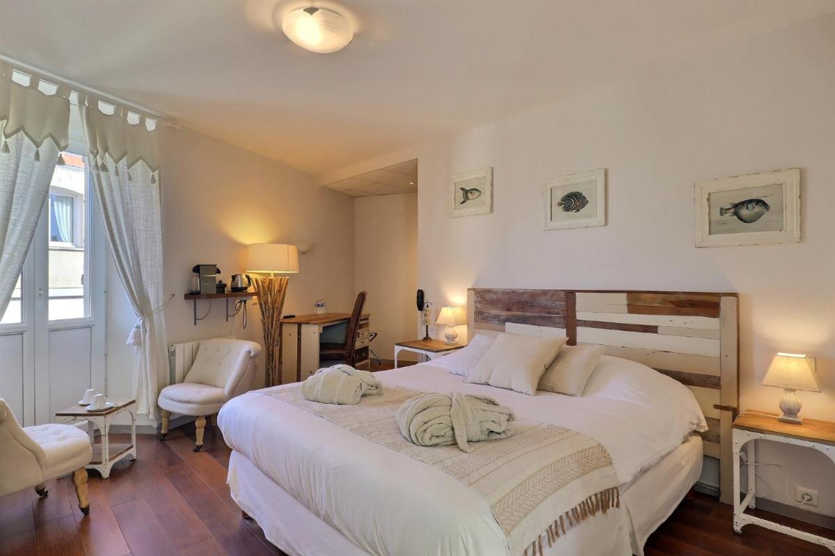 Un ou plusieurs lits dans un hébergement de l'établissement Grand Hôtel des Bains SPA