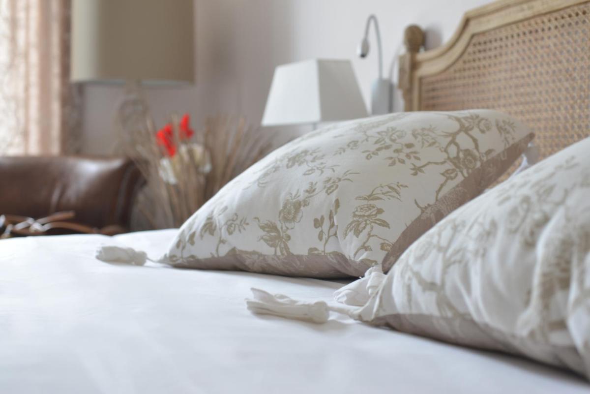 Un ou plusieurs lits dans un hébergement de l'établissement Grand Hôtel des Bains SPA