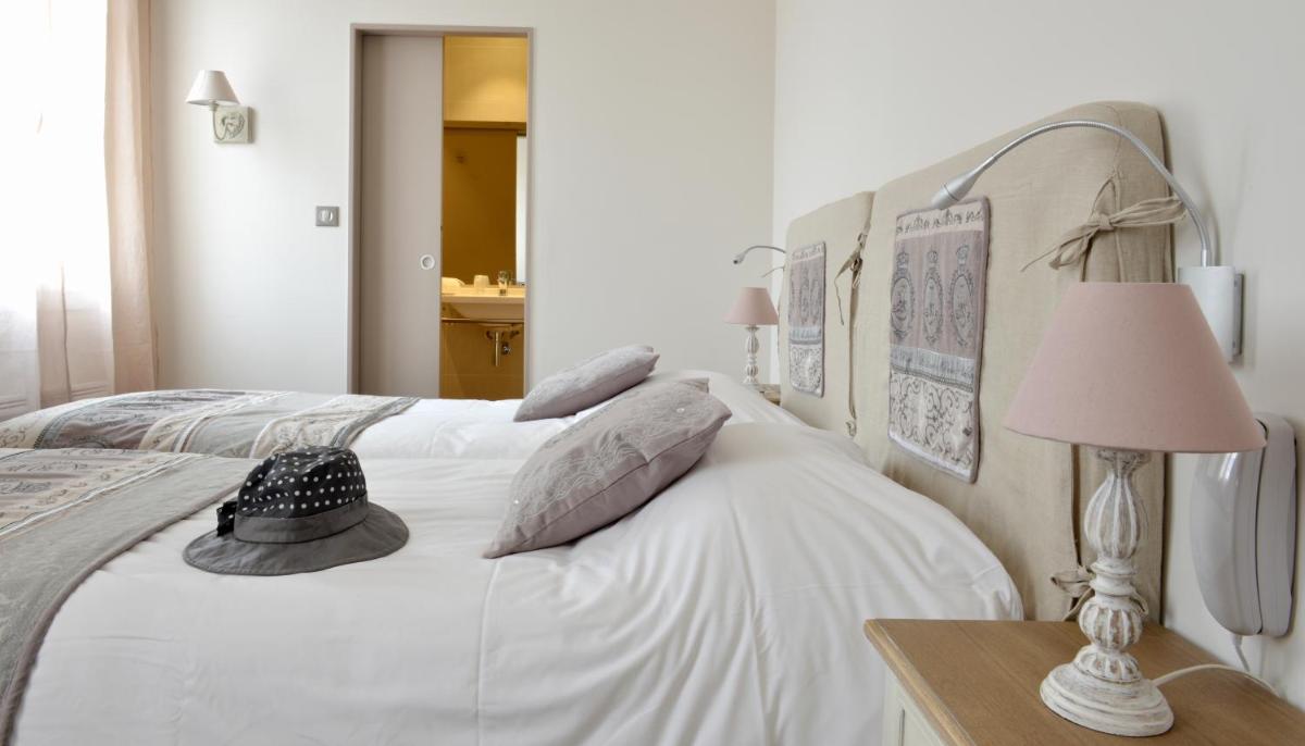 Un ou plusieurs lits dans un hébergement de l'établissement Grand Hôtel des Bains SPA
