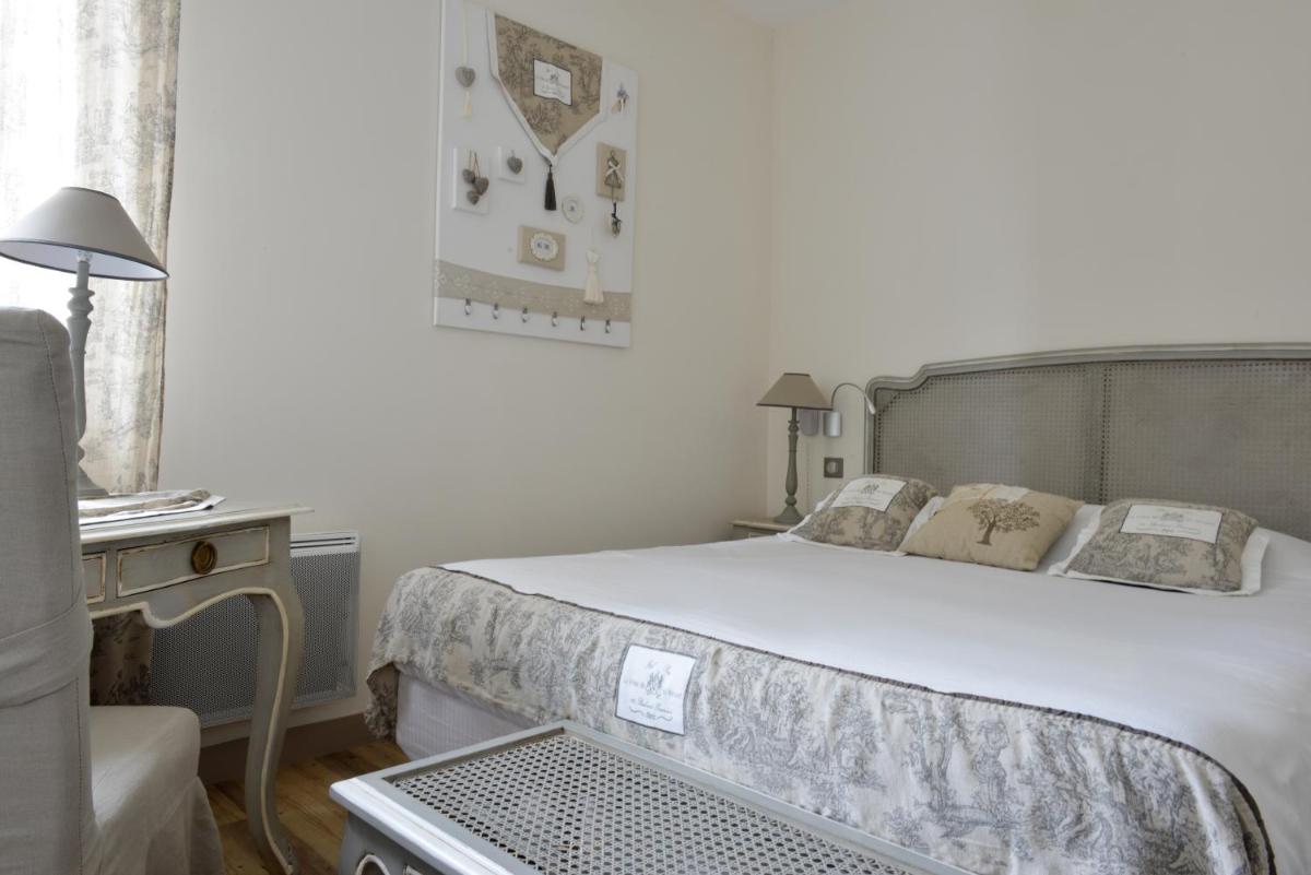 Un ou plusieurs lits dans un hébergement de l'établissement Grand Hôtel des Bains SPA