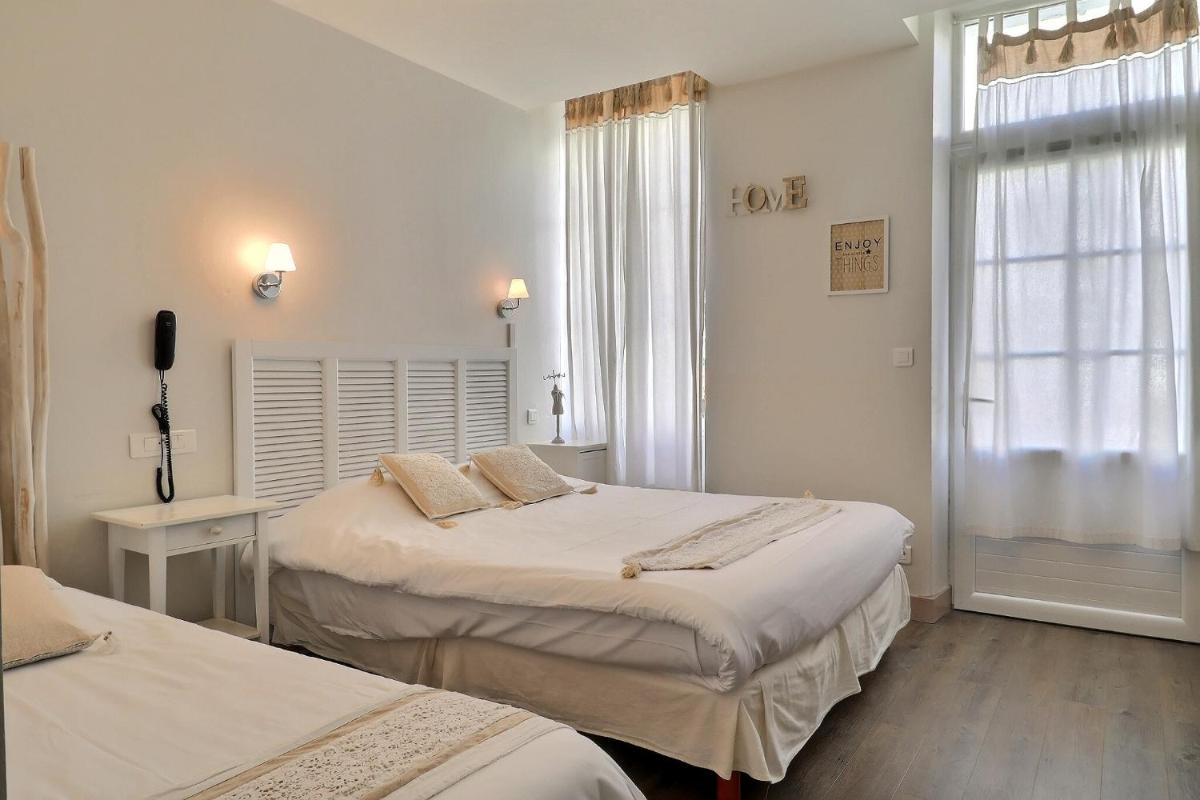 Un ou plusieurs lits dans un hébergement de l'établissement Grand Hôtel des Bains SPA