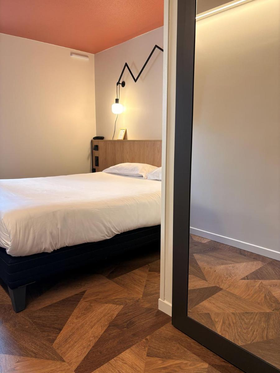 Un ou plusieurs lits dans un hébergement de l'établissement Sure Hotel by Best Western Annecy