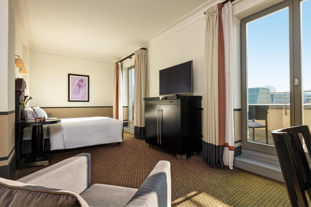 Ein Bett oder Betten in einem Zimmer der Unterkunft Hotel De Rome Berlin