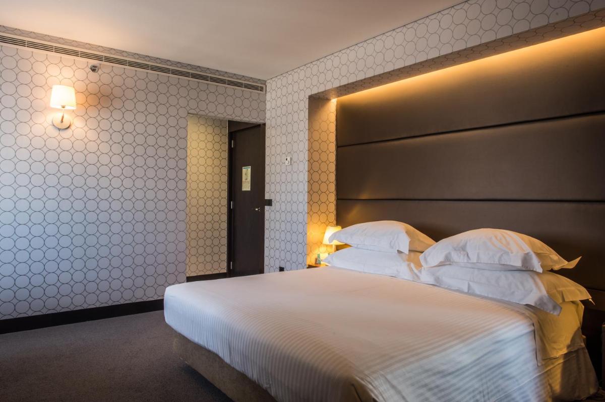 Uma cama ou camas num quarto em Porto Palácio Hotel by The Editory