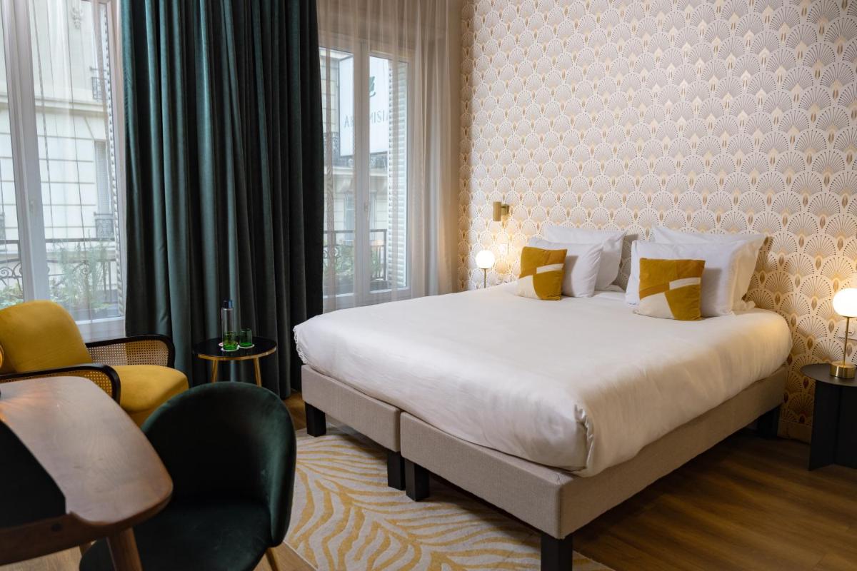 Un ou plusieurs lits dans un hébergement de l'établissement Hôtel Artemisia Montmartre