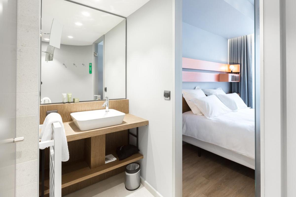 Un ou plusieurs lits dans un hébergement de l'établissement Golden Tulip Saint Malo– Le Grand Bé