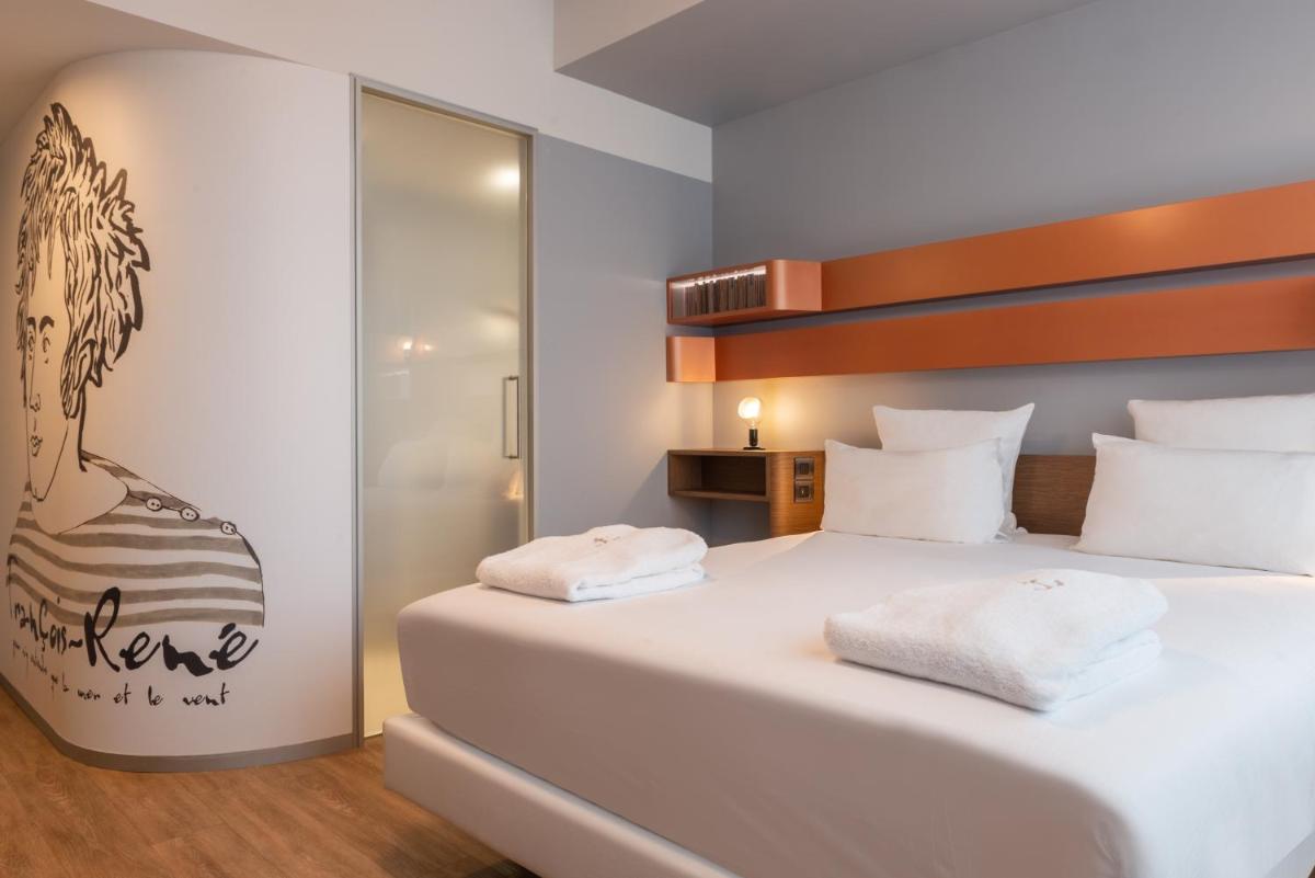 Un ou plusieurs lits dans un hébergement de l'établissement Golden Tulip Saint Malo– Le Grand Bé