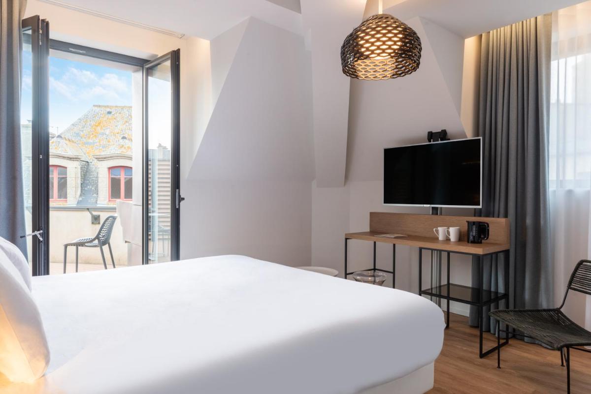 Un ou plusieurs lits dans un hébergement de l'établissement Golden Tulip Saint Malo– Le Grand Bé