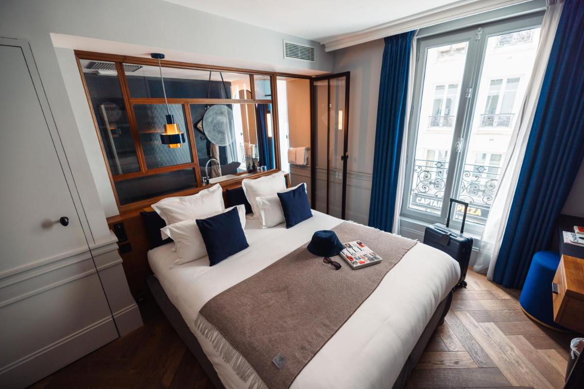 Un ou plusieurs lits dans un hébergement de l'établissement Maison ELLE Paris