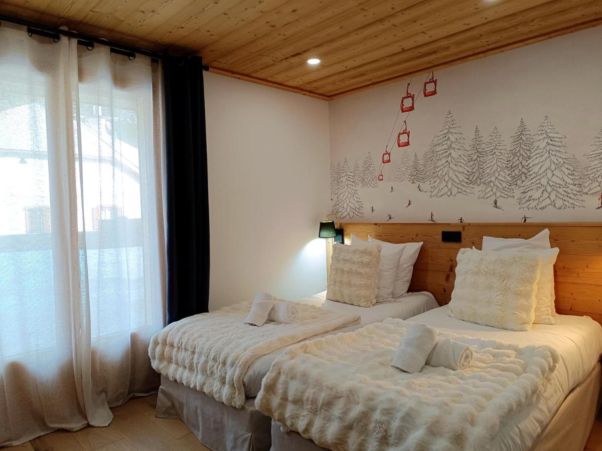 Un ou plusieurs lits dans un hébergement de l'établissement Hôtel Mont Thabor Serre Chevalier