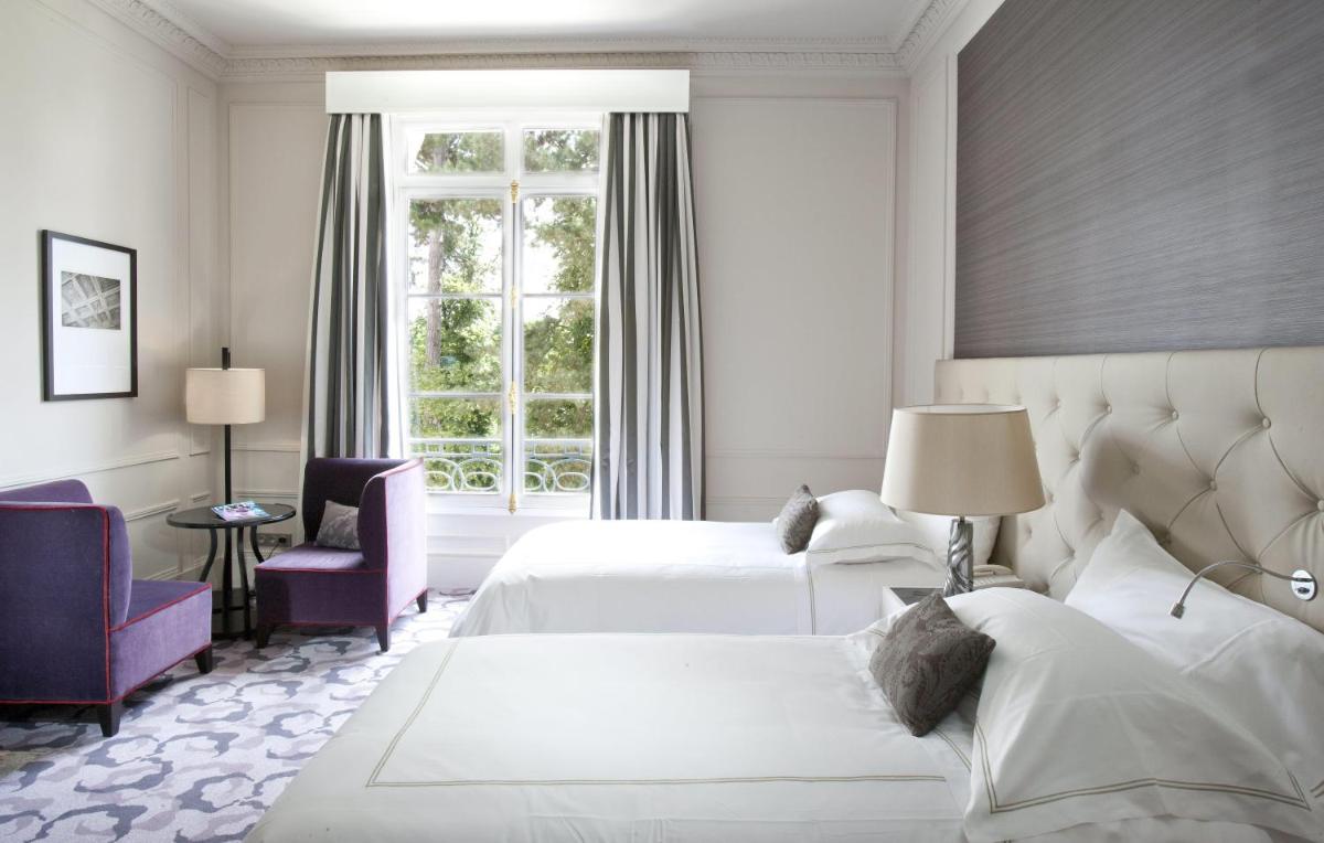 Un ou plusieurs lits dans un hébergement de l'établissement Waldorf Astoria Versailles - Trianon Palace