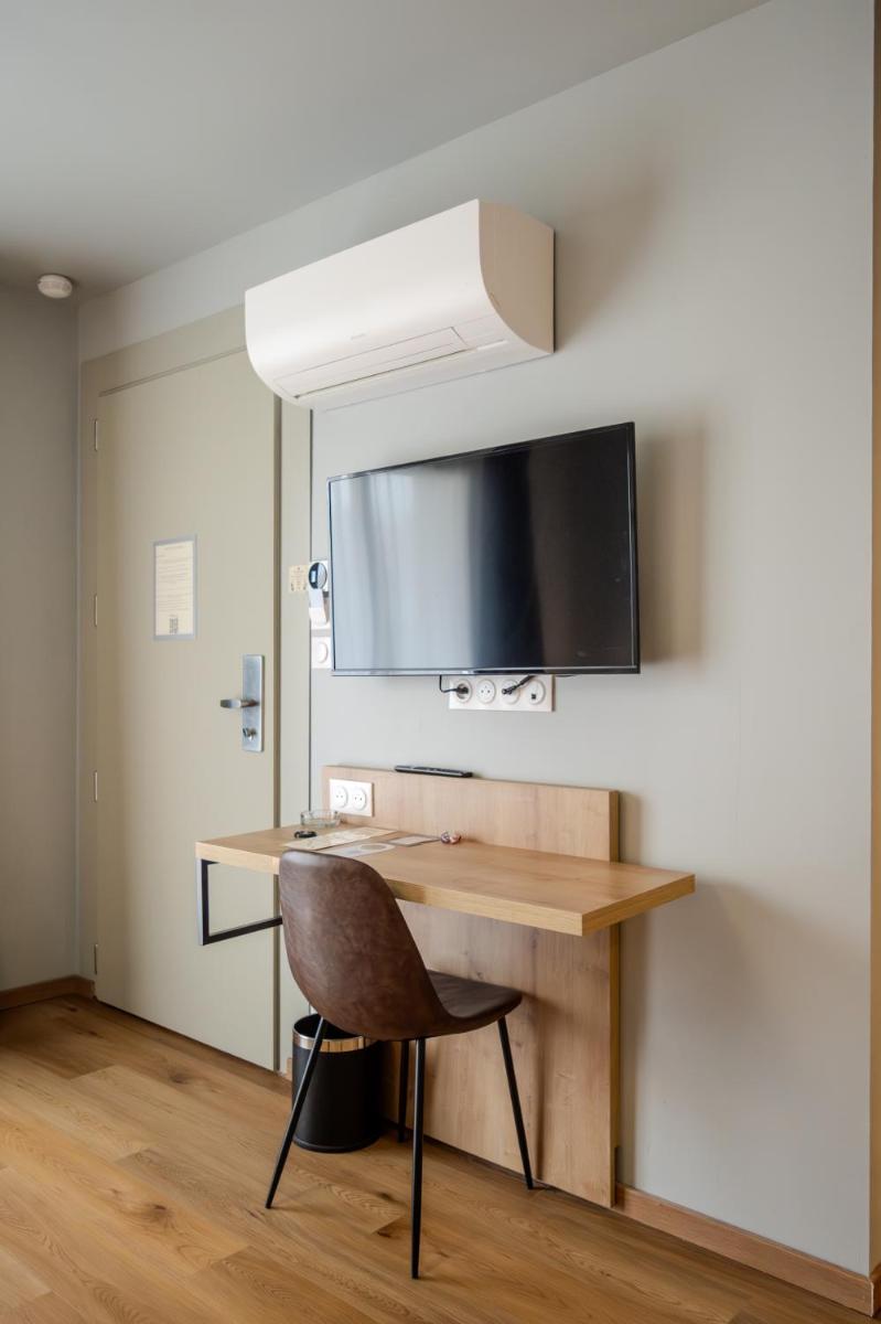 Télévision ou salle de divertissement dans l'établissement Tulip Inn Honfleur Residence & Spa