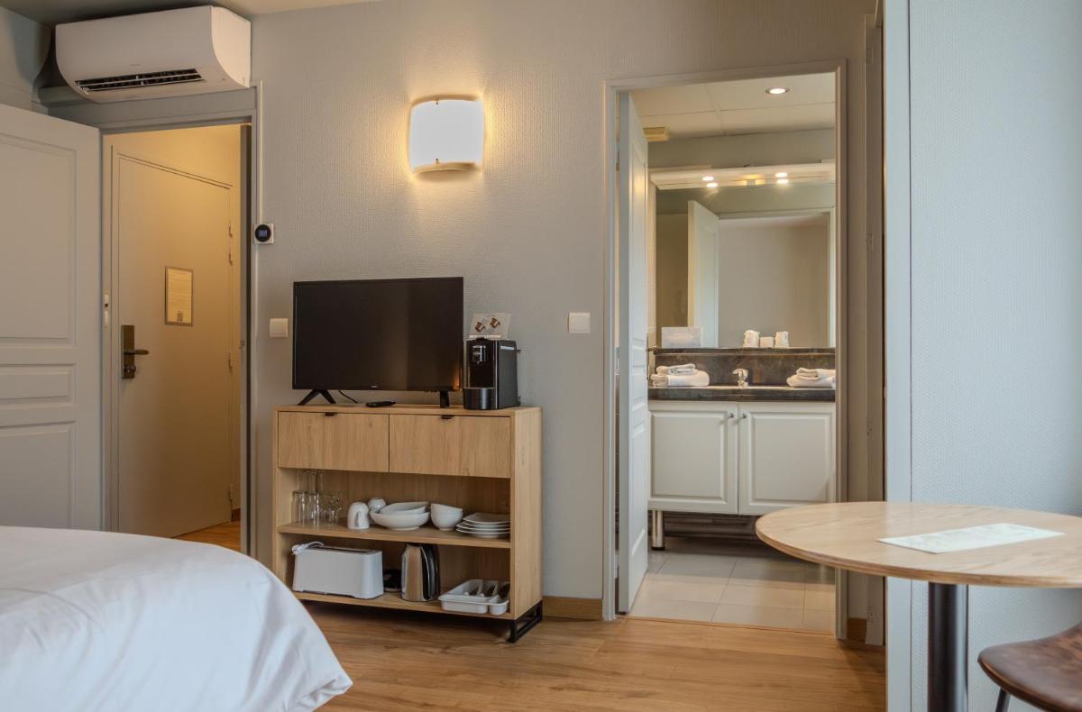 Télévision ou salle de divertissement dans l'établissement Tulip Inn Honfleur Residence & Spa