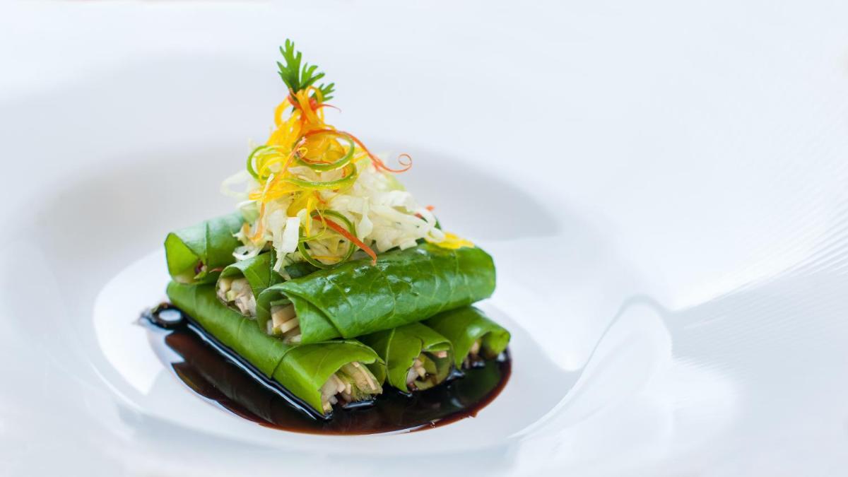 a plate of food with vegetables and sauce on it at Feathers- A Radha Hotel, Chennai in Chennai