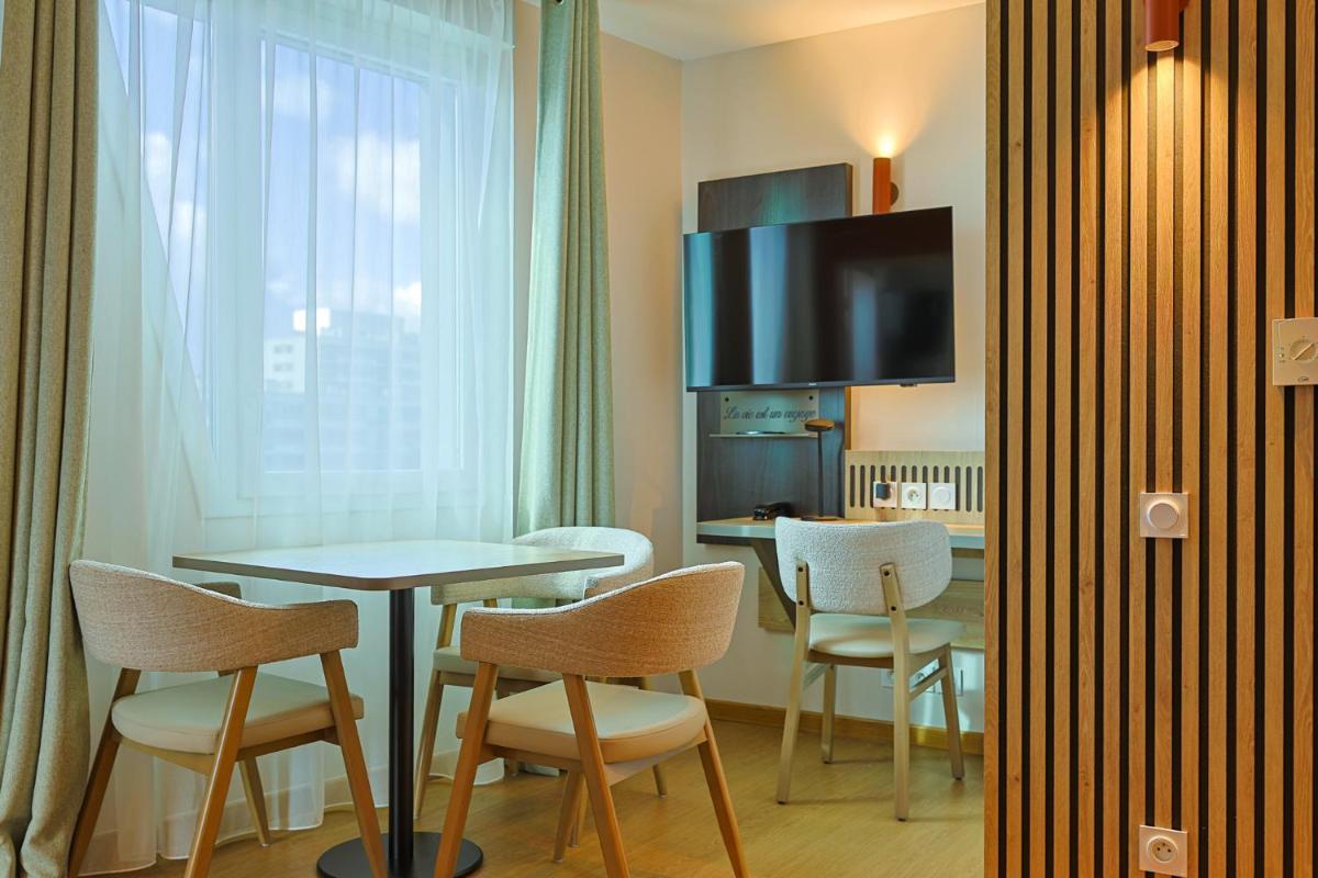 Cuisine ou kitchenette dans l'établissement Seven Urban Suites Nantes Centre