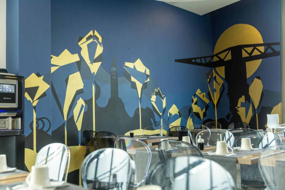 Restaurant ou autre lieu de restauration dans l'établissement Seven Urban Suites Nantes Centre