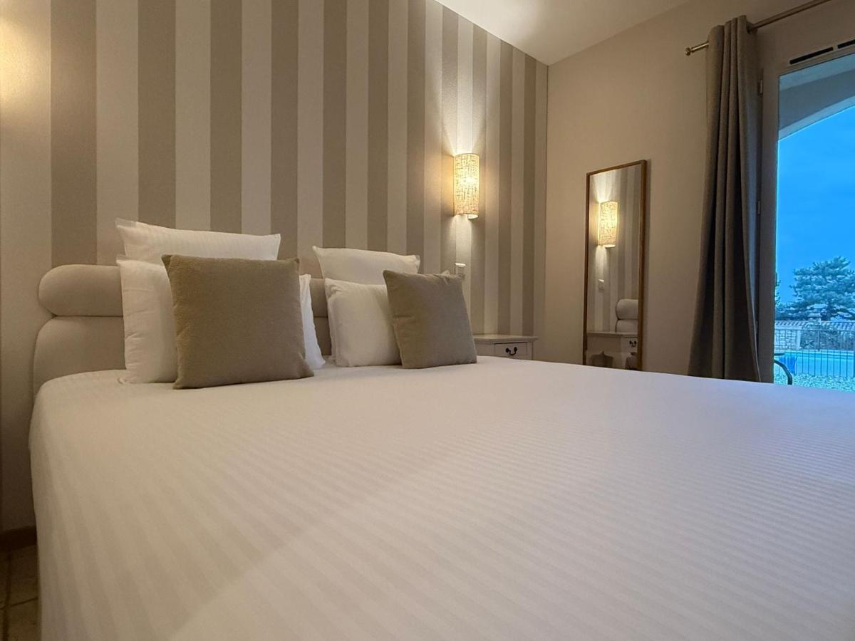 Un ou plusieurs lits dans un hébergement de l'établissement CÉRÈS - Boutique-Hôtel & Spa