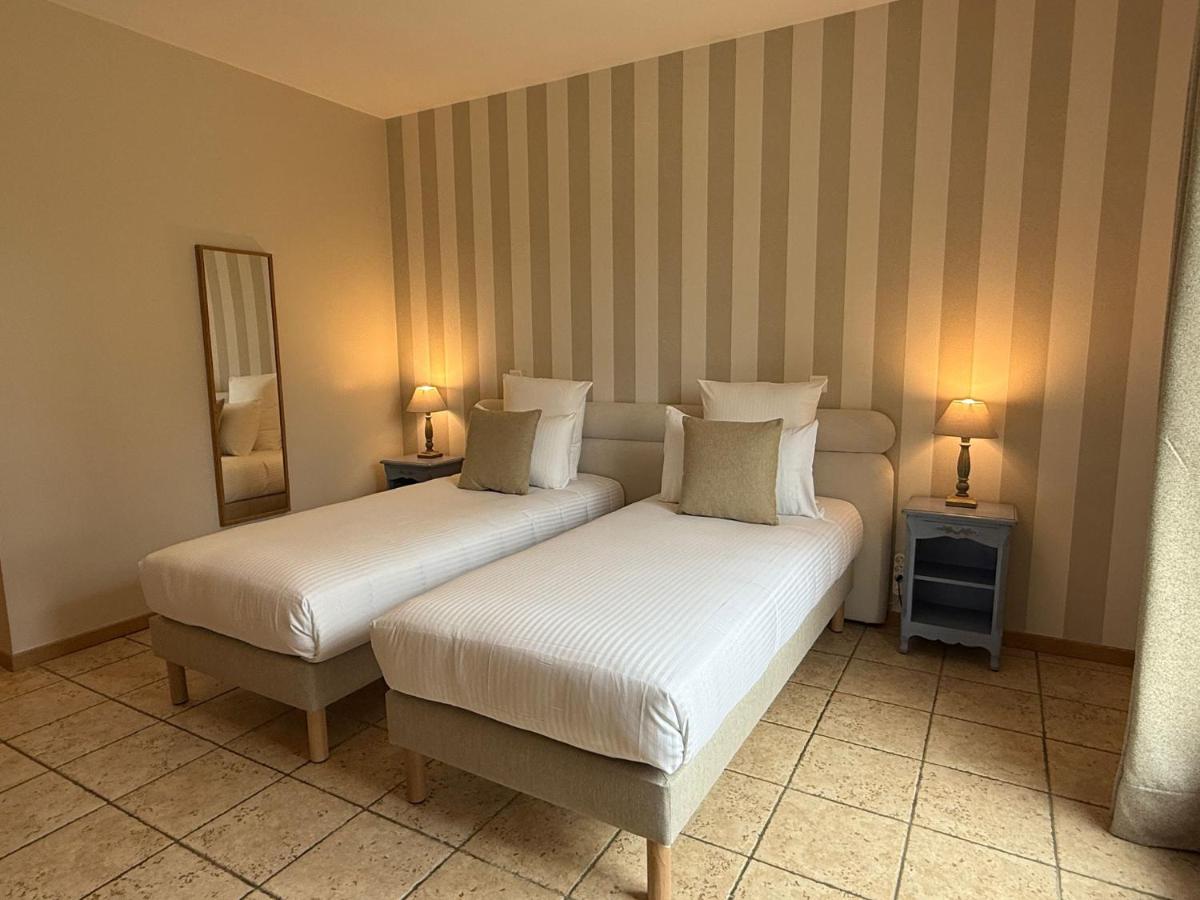 Un ou plusieurs lits dans un hébergement de l'établissement CÉRÈS - Boutique-Hôtel & Spa
