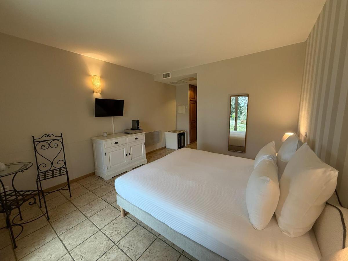 Un ou plusieurs lits dans un hébergement de l'établissement CÉRÈS - Boutique-Hôtel & Spa