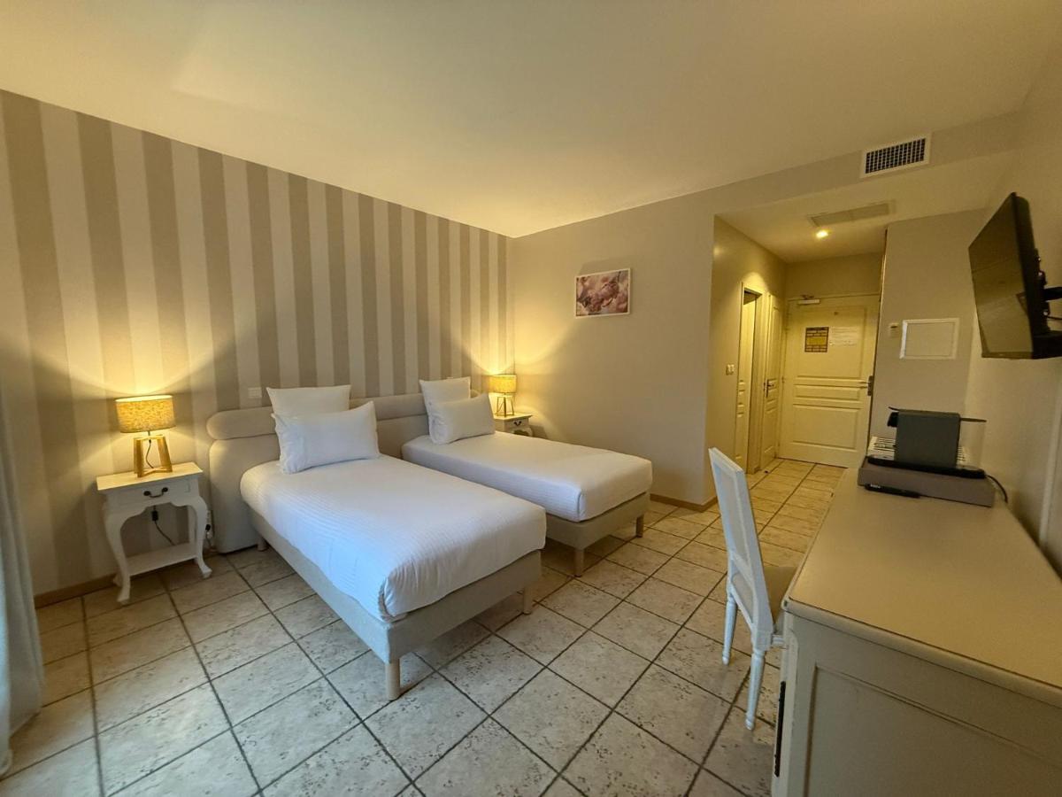 Un ou plusieurs lits dans un hébergement de l'établissement CÉRÈS - Boutique-Hôtel & Spa