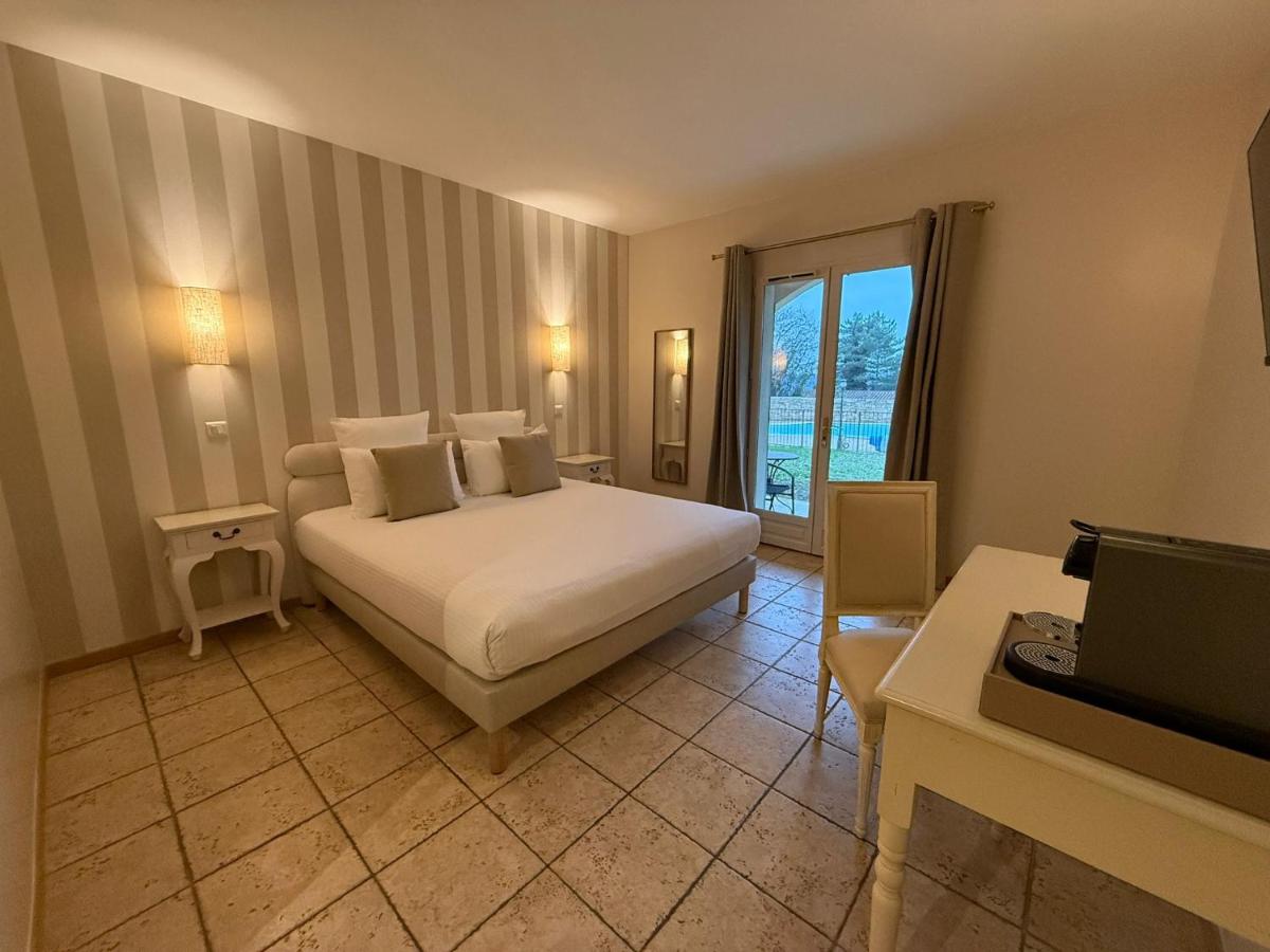 Un ou plusieurs lits dans un hébergement de l'établissement CÉRÈS - Boutique-Hôtel & Spa