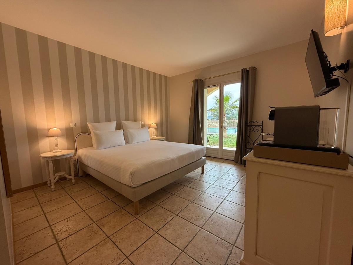 Un ou plusieurs lits dans un hébergement de l'établissement CÉRÈS - Boutique-Hôtel & Spa