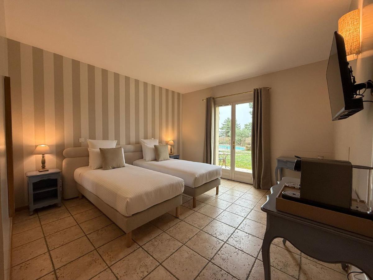 Un ou plusieurs lits dans un hébergement de l'établissement CÉRÈS - Boutique-Hôtel & Spa