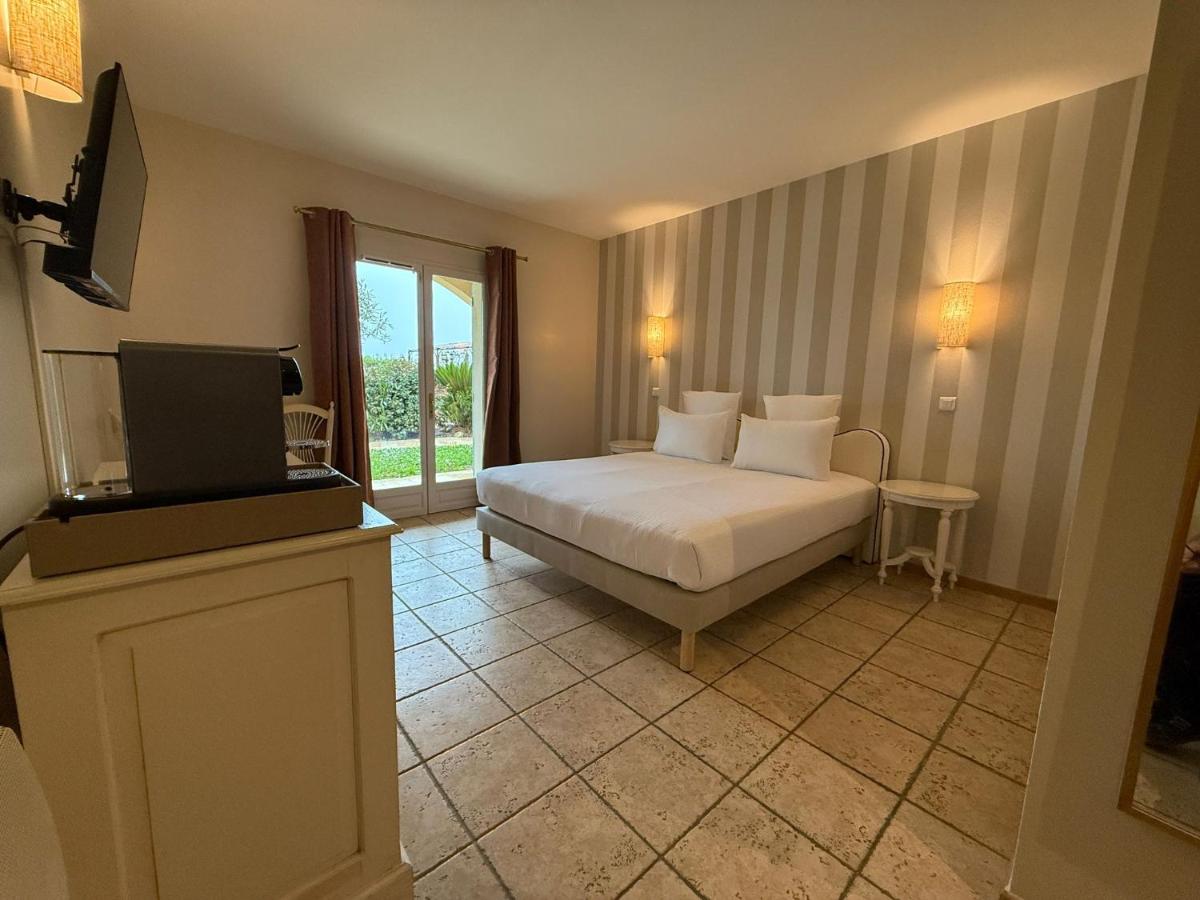 Un ou plusieurs lits dans un hébergement de l'établissement CÉRÈS - Boutique-Hôtel & Spa