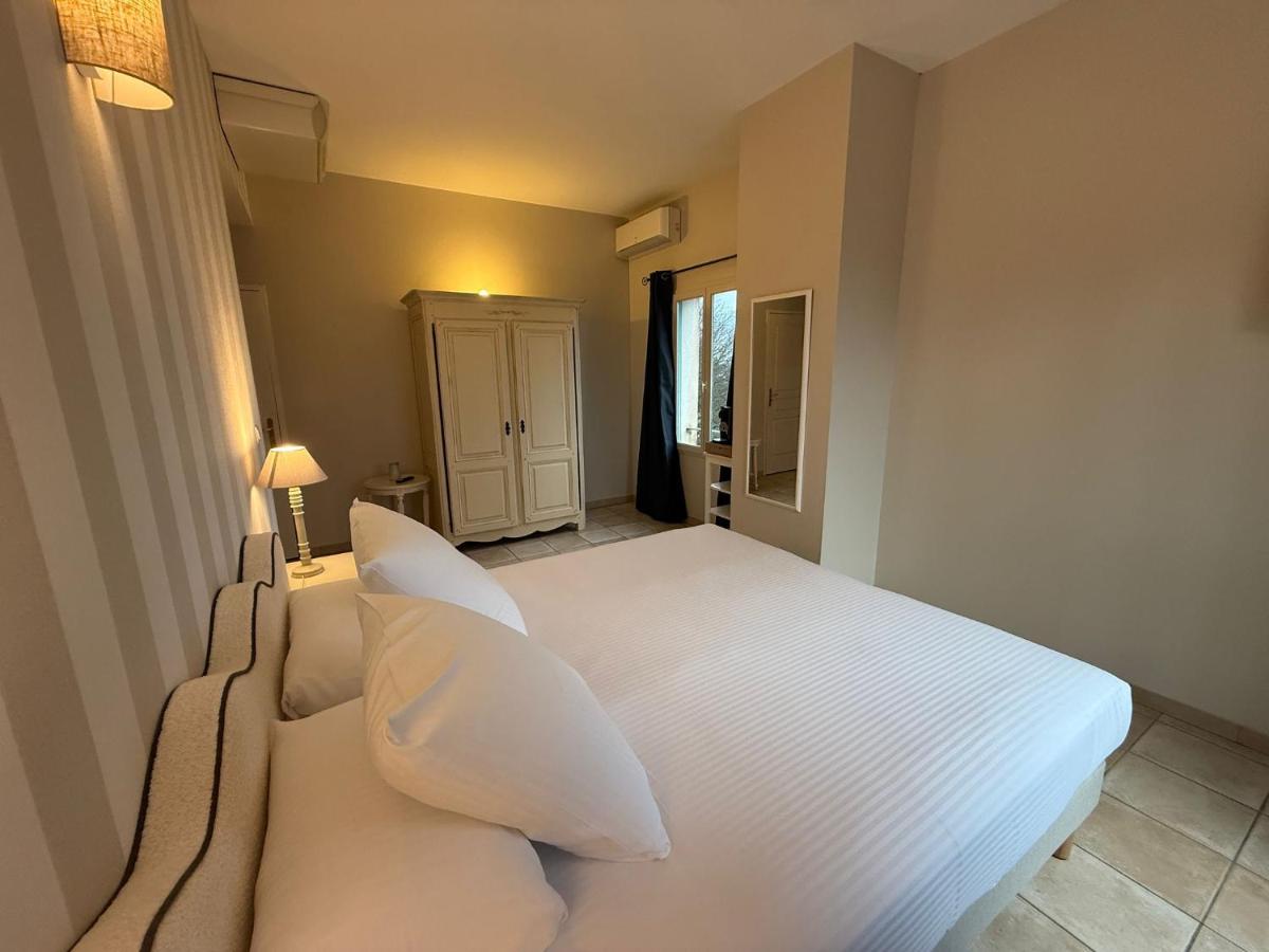 Un ou plusieurs lits dans un hébergement de l'établissement CÉRÈS - Boutique-Hôtel & Spa
