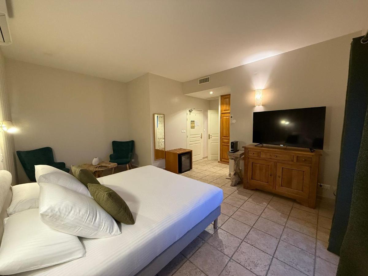 Un ou plusieurs lits dans un hébergement de l'établissement CÉRÈS - Boutique-Hôtel & Spa