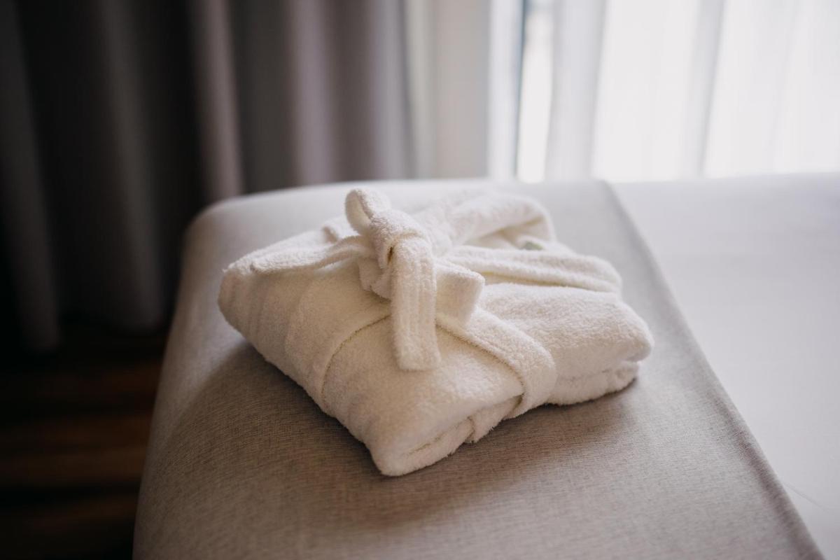 Uma cama ou camas num quarto em The Prime Energize Hotel & SPA - Algarve