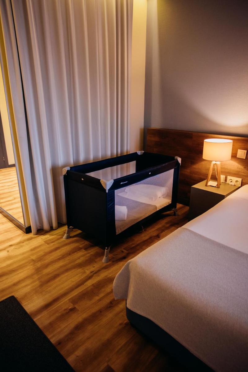 Uma cama ou camas num quarto em The Prime Energize Hotel & SPA - Algarve