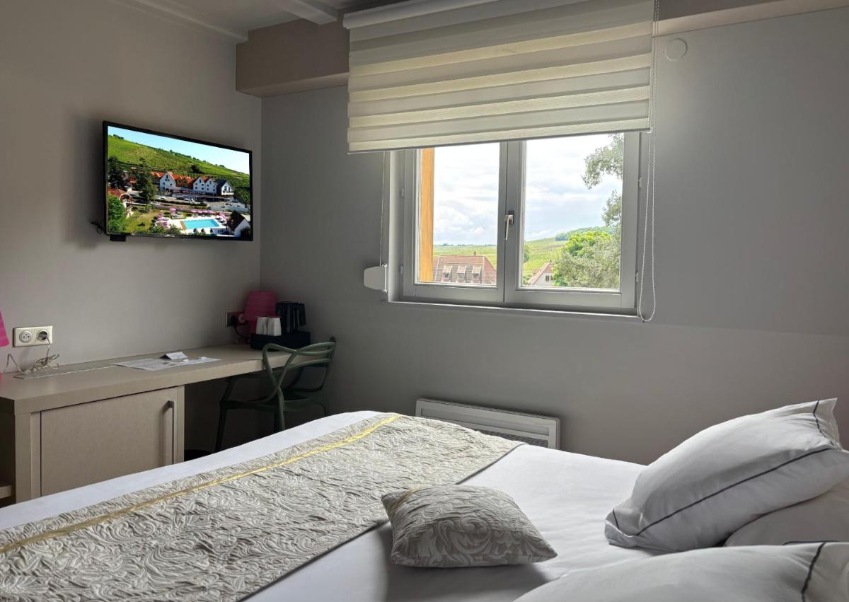 Un ou plusieurs lits dans un hébergement de l'établissement Best Western Plus Hotel & SPA Le Schoenenbourg