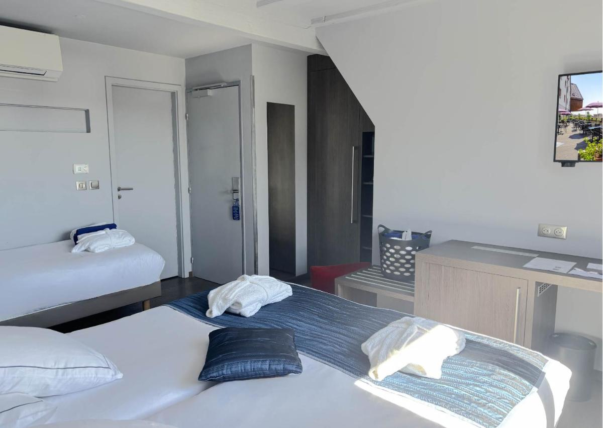 Un ou plusieurs lits dans un hébergement de l'établissement Best Western Plus Hotel & SPA Le Schoenenbourg