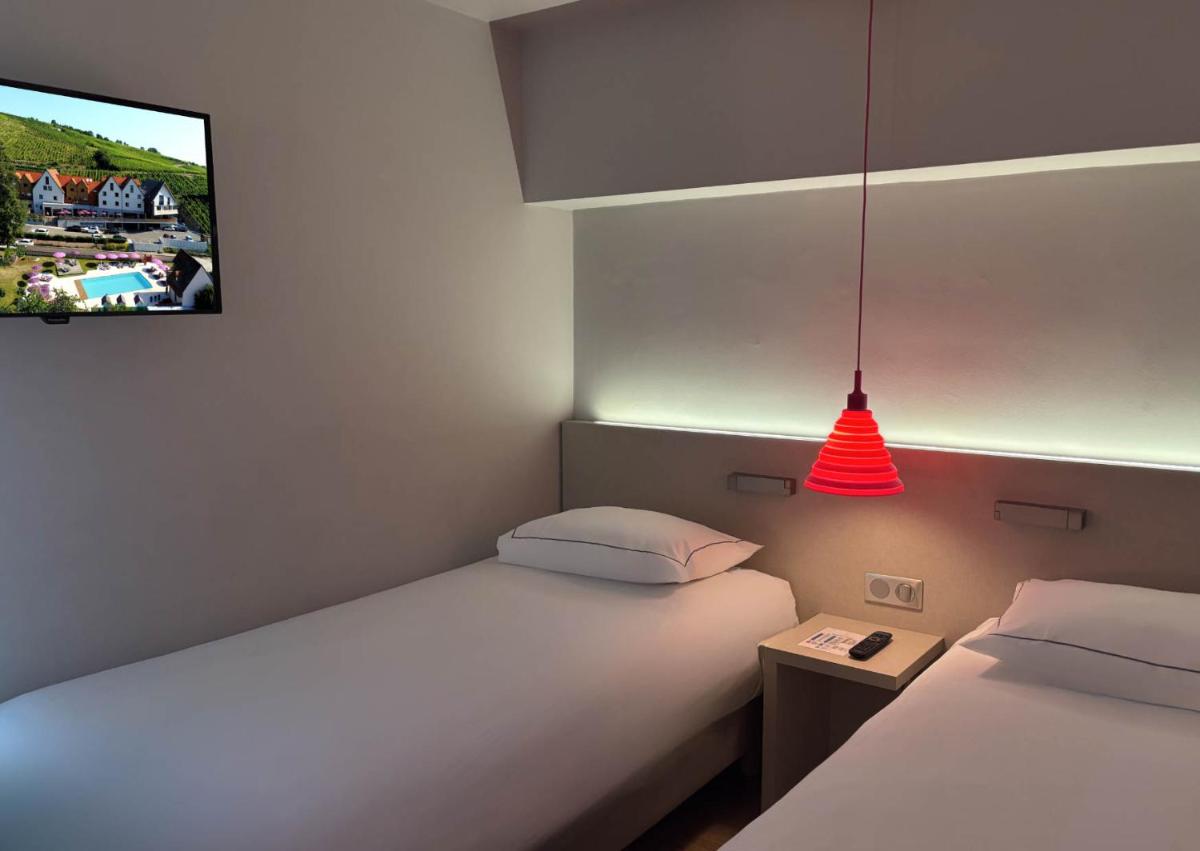 Un ou plusieurs lits dans un hébergement de l'établissement Best Western Plus Hotel & SPA Le Schoenenbourg