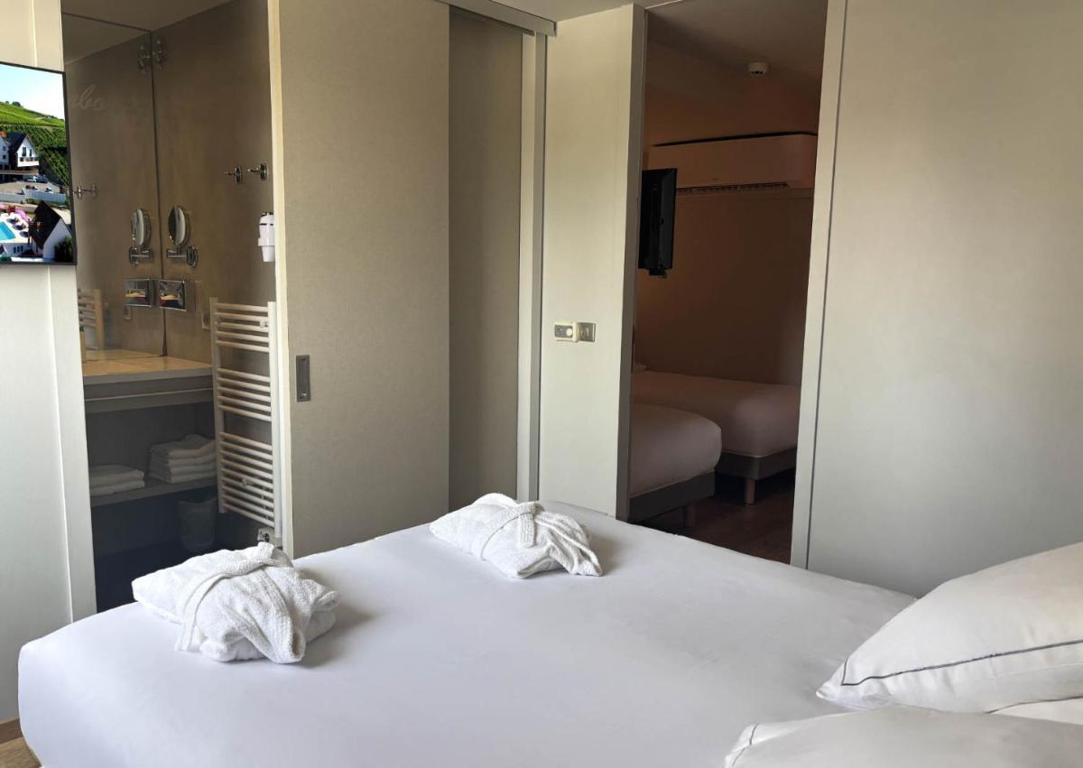 Un ou plusieurs lits dans un hébergement de l'établissement Best Western Plus Hotel & SPA Le Schoenenbourg