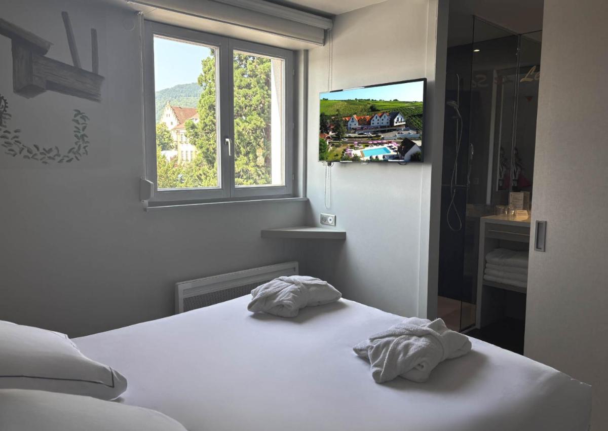 Un ou plusieurs lits dans un hébergement de l'établissement Best Western Plus Hotel & SPA Le Schoenenbourg