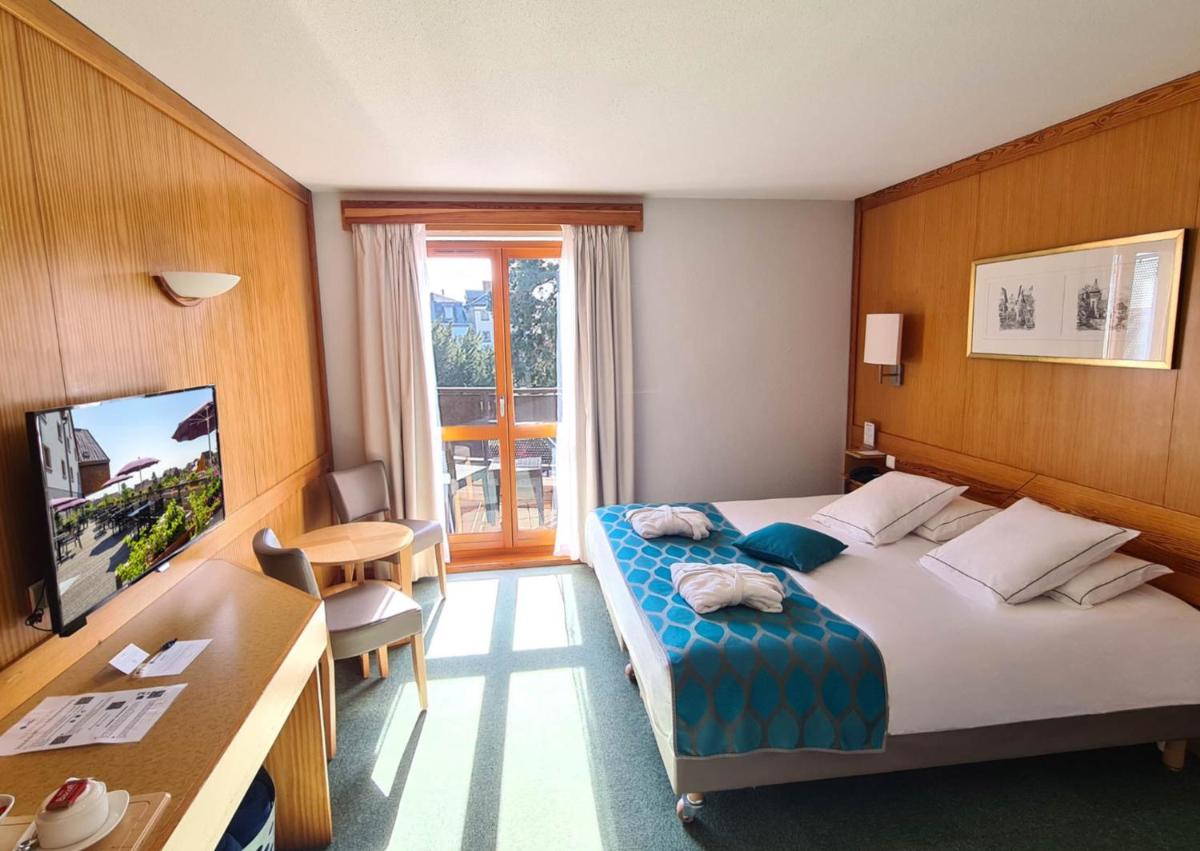 Un ou plusieurs lits dans un hébergement de l'établissement Best Western Plus Hotel & SPA Le Schoenenbourg