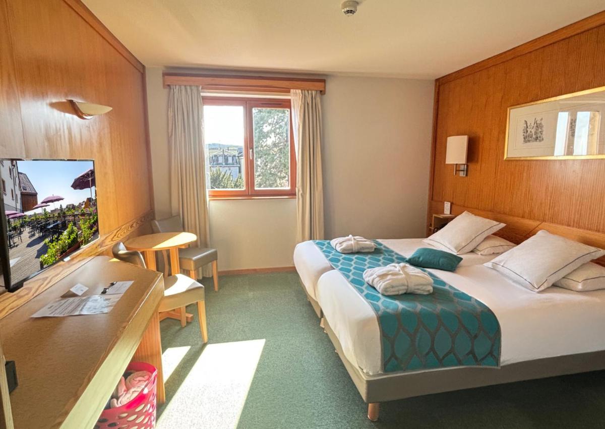 Un ou plusieurs lits dans un hébergement de l'établissement Best Western Plus Hotel & SPA Le Schoenenbourg