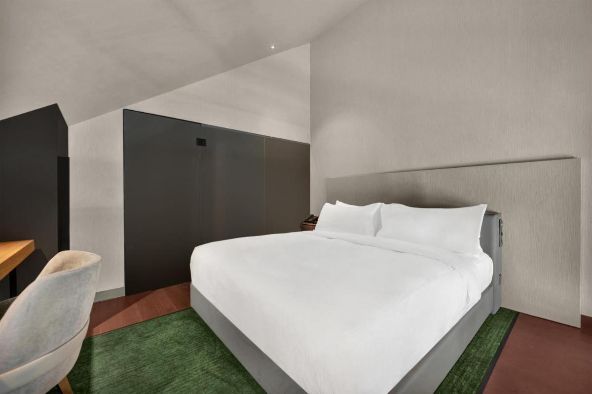 Uma cama ou camas num quarto em Hilton Porto Gaia
