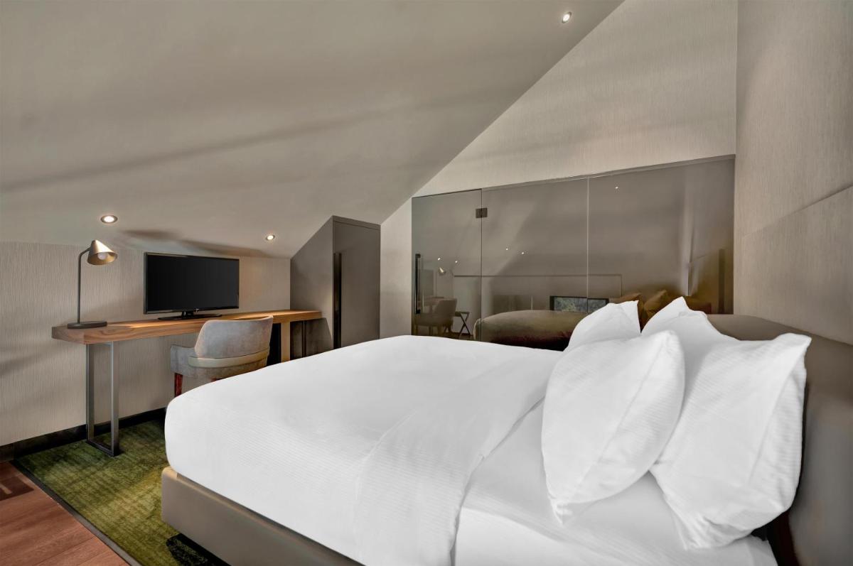 Uma cama ou camas num quarto em Hilton Porto Gaia
