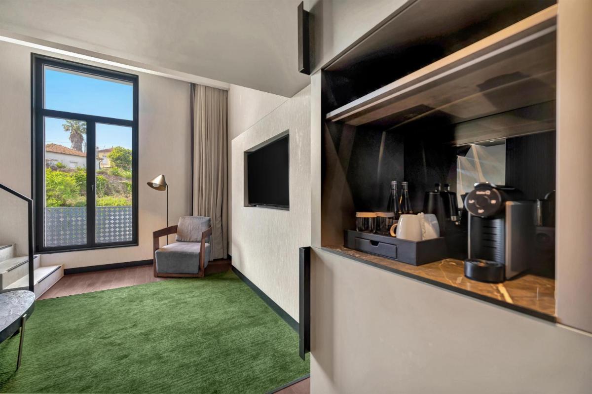 Uma televisão e/ou sistema de entretenimento em Hilton Porto Gaia