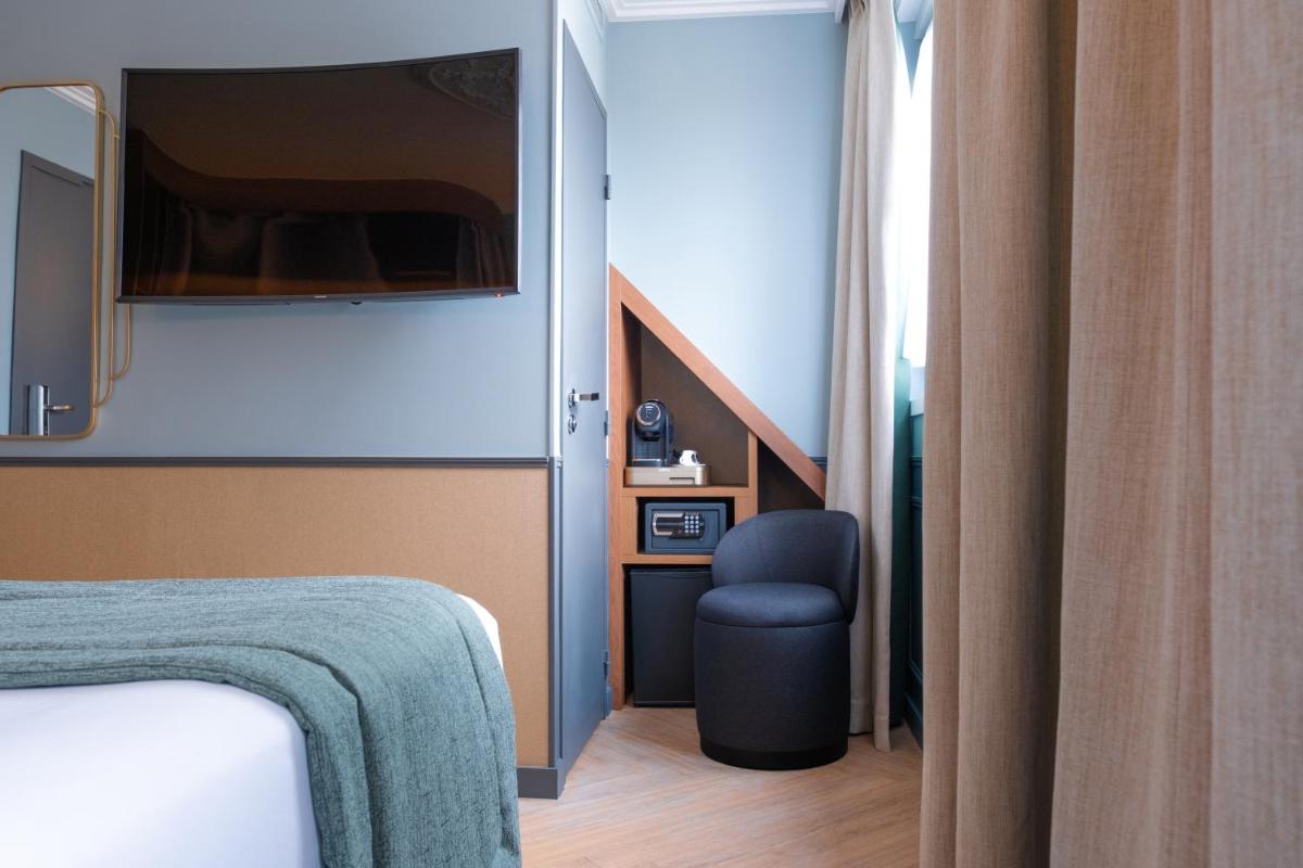 Télévision ou salle de divertissement dans l'établissement Grand Hotel Saint Michel