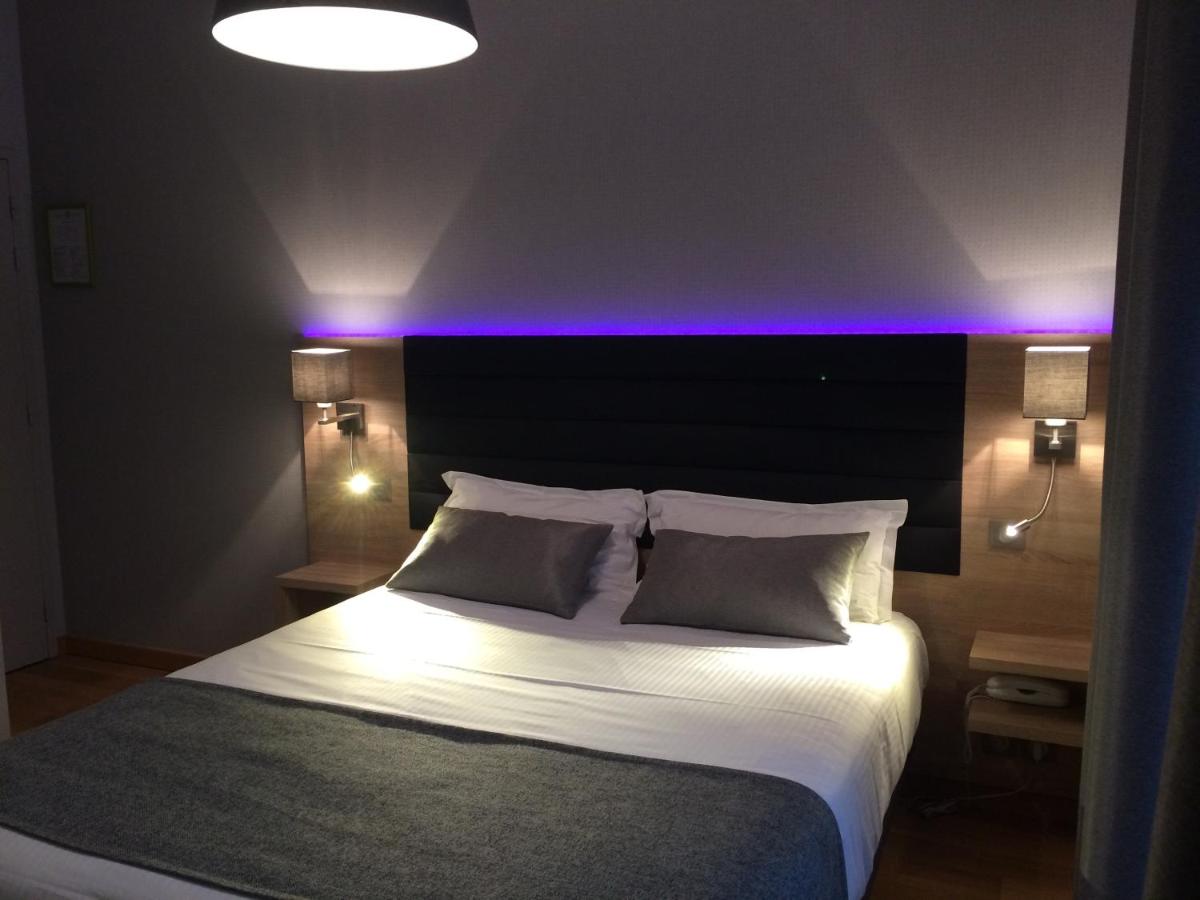 Un ou plusieurs lits dans un hébergement de l'établissement Hôtel Lutétia & Spa