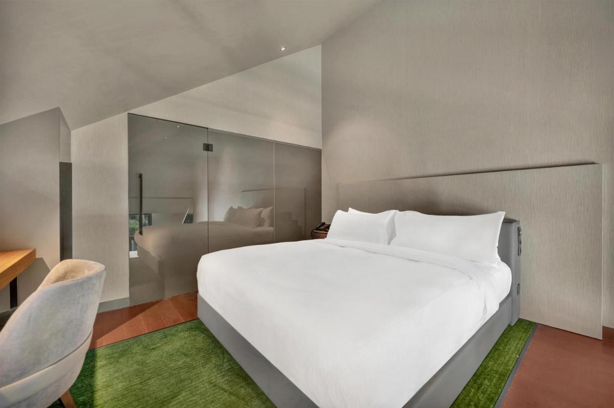 Uma cama ou camas num quarto em Hilton Porto Gaia