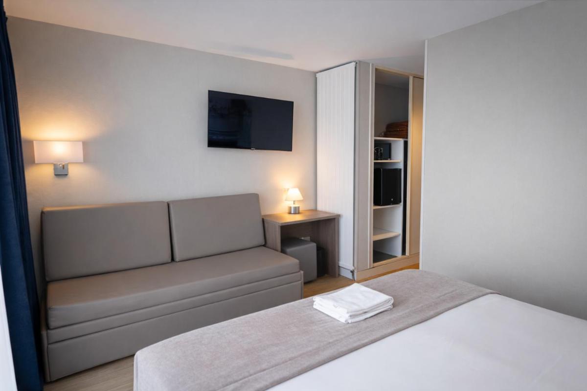 Un ou plusieurs lits dans un hébergement de l'établissement Hotel Europa