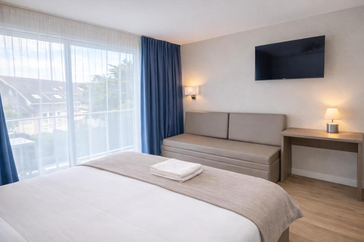 Un ou plusieurs lits dans un hébergement de l'établissement Hotel Europa