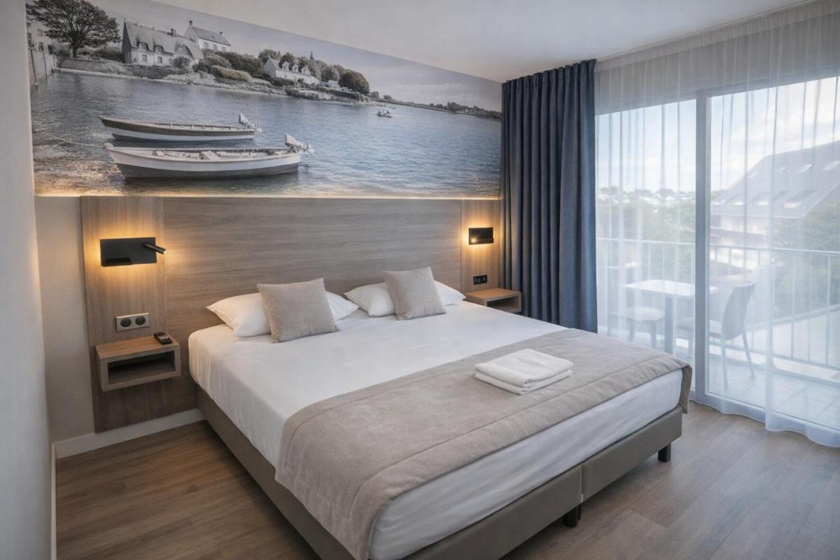 Un ou plusieurs lits dans un hébergement de l'établissement Hotel Europa